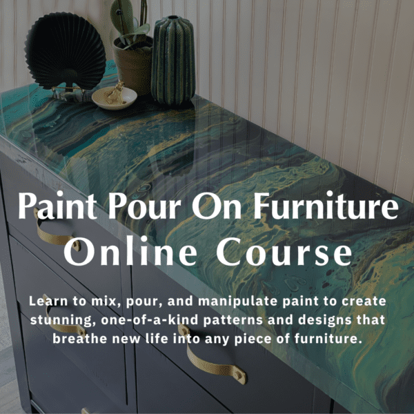 Artistic paint pour on furniture technique on a dresser featuring swirling blue and green hues, complemented by stylish decor accessories.