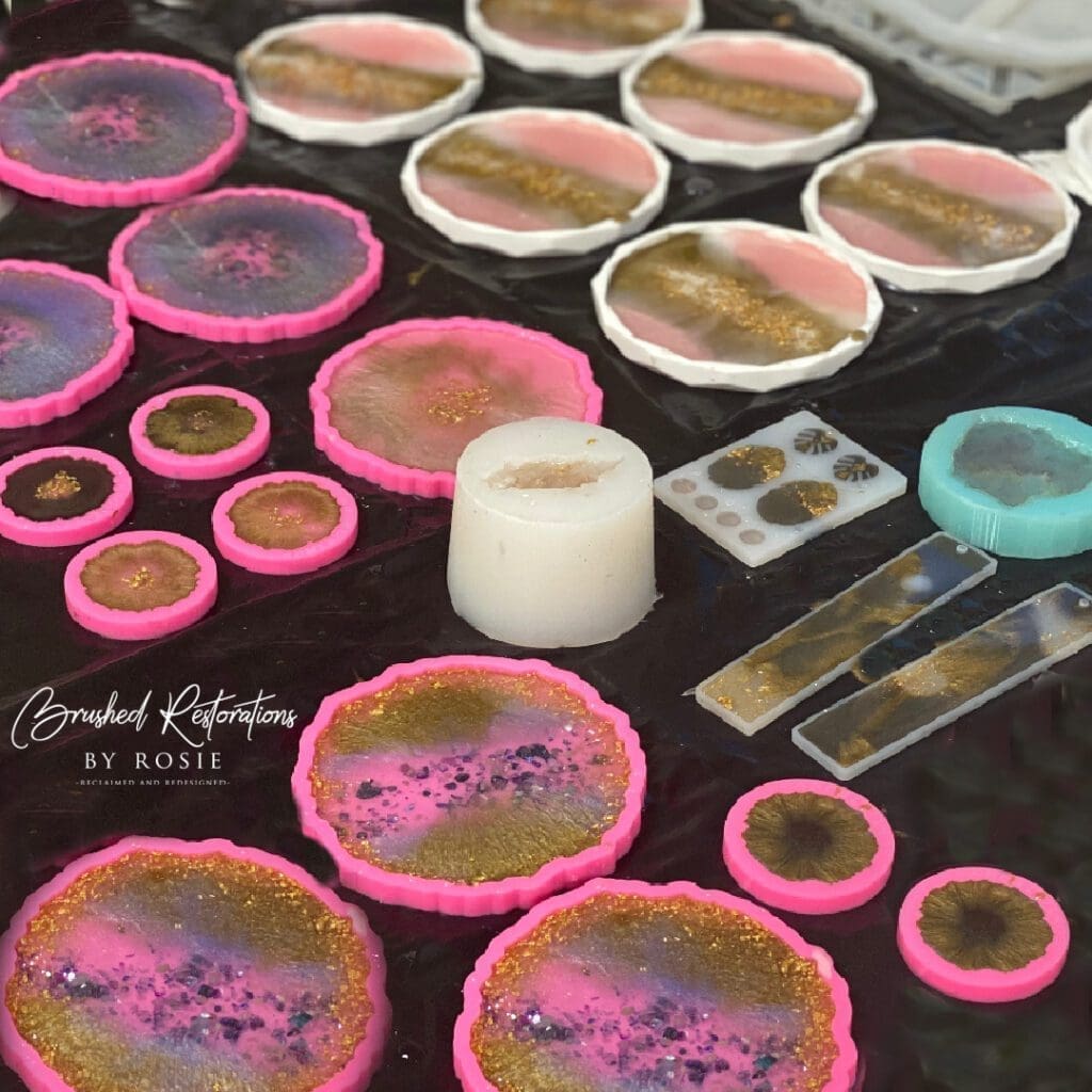 A table with various pink silicone molds for resin art.