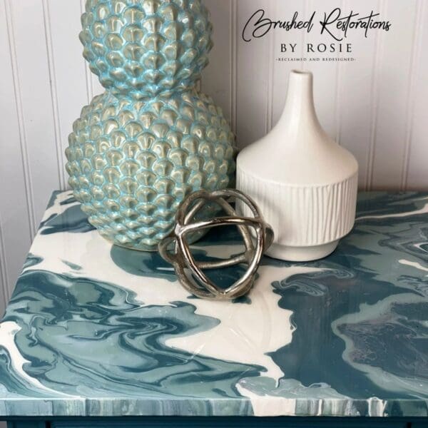 A table with blue and white marble top