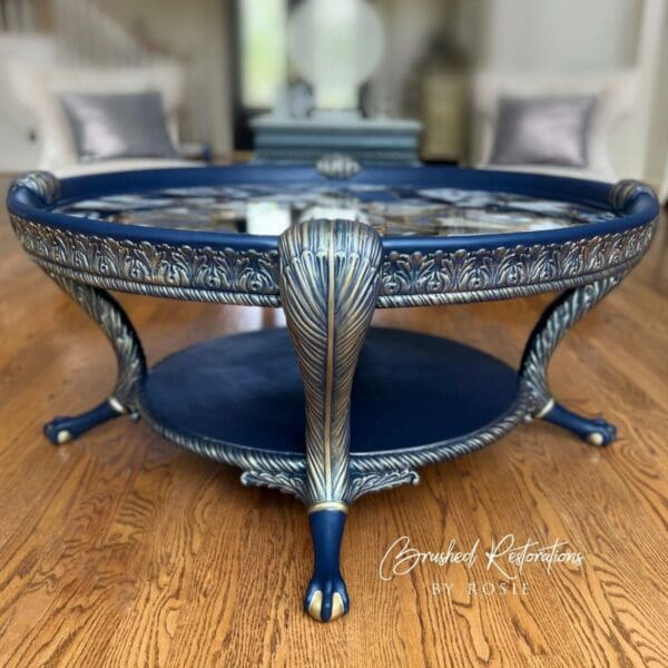 A blue and silver table with two tables in the background