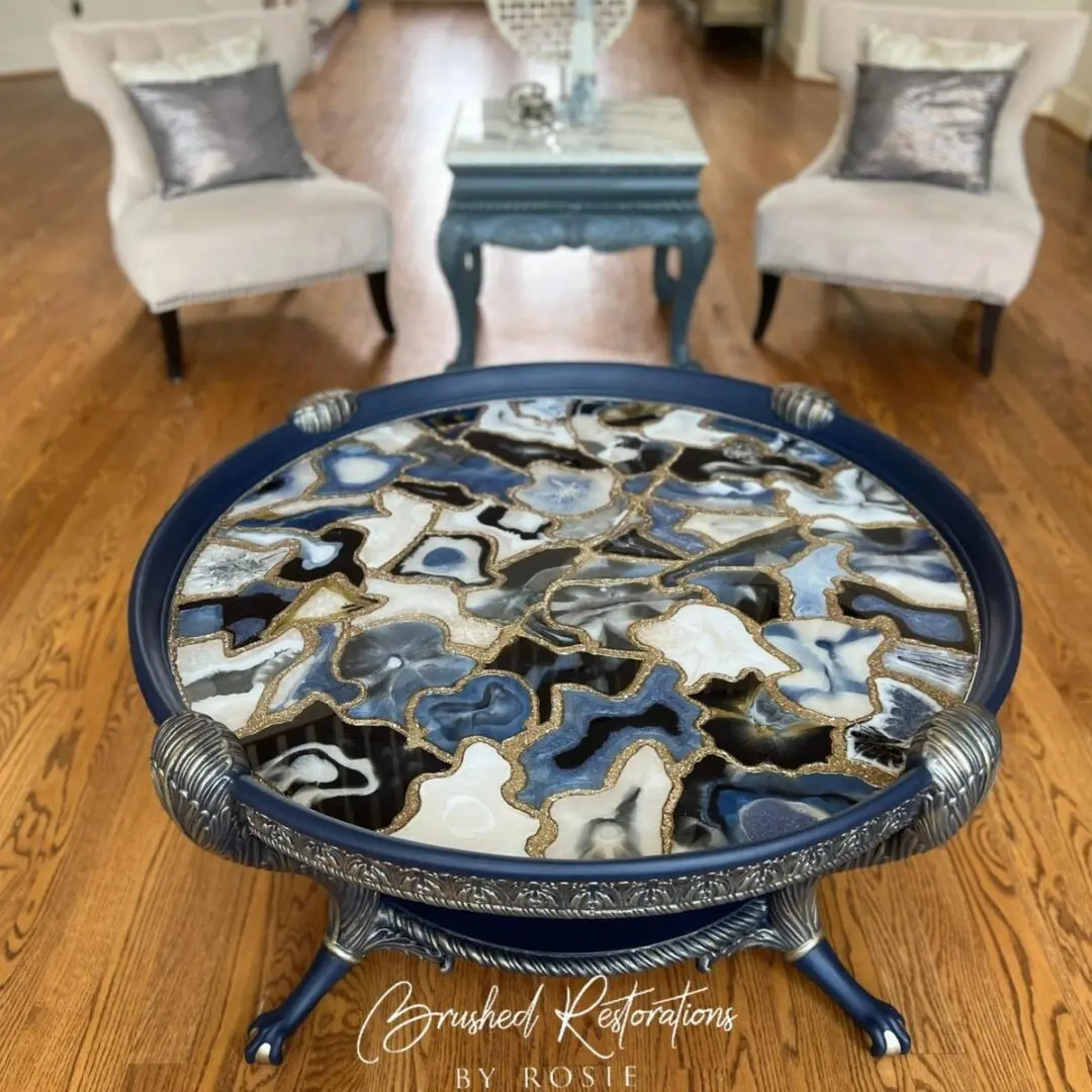 A round coffee table with a black and white agate top.