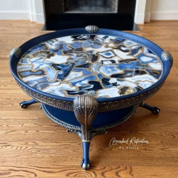 A blue table with a black and white agate top