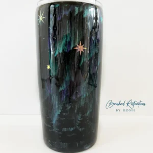 A black cup with stars on it