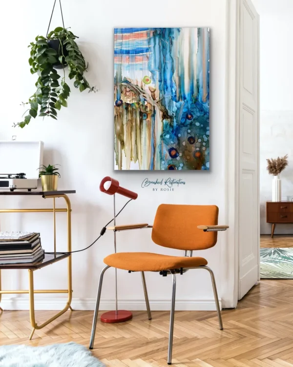 A chair and table in front of a painting.