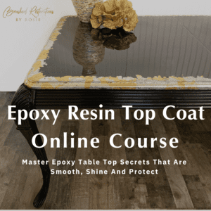 Elegant black epoxy resin tabletop with a reflective finish and decorative vase, promoting the Epoxy Resin Top Coat Online Course by Brushed Restorations by Rosie.