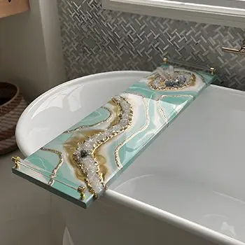 A white bathtub with a blue and gold marble design.