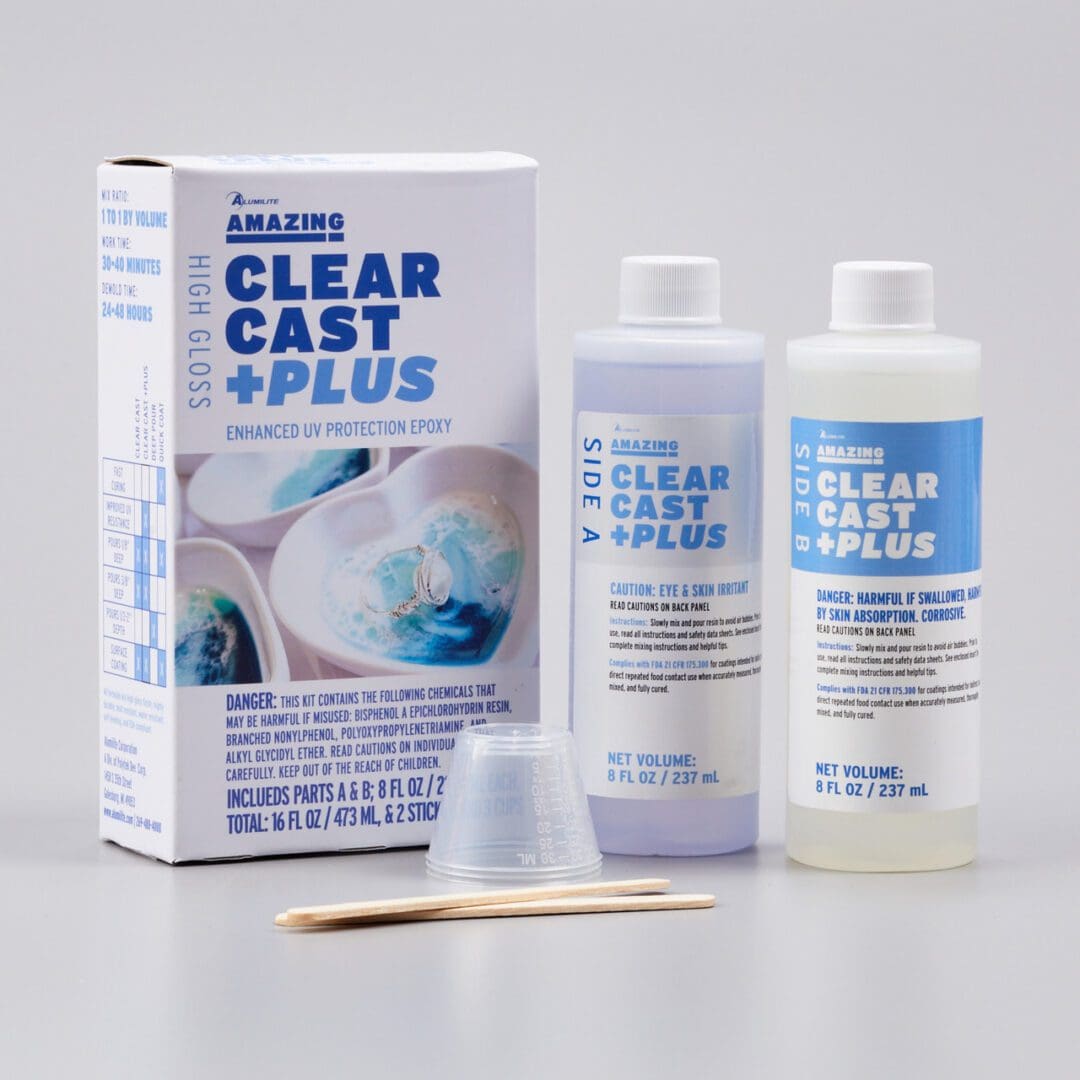 A box of clear cast plus with two bottles and a toothpick.