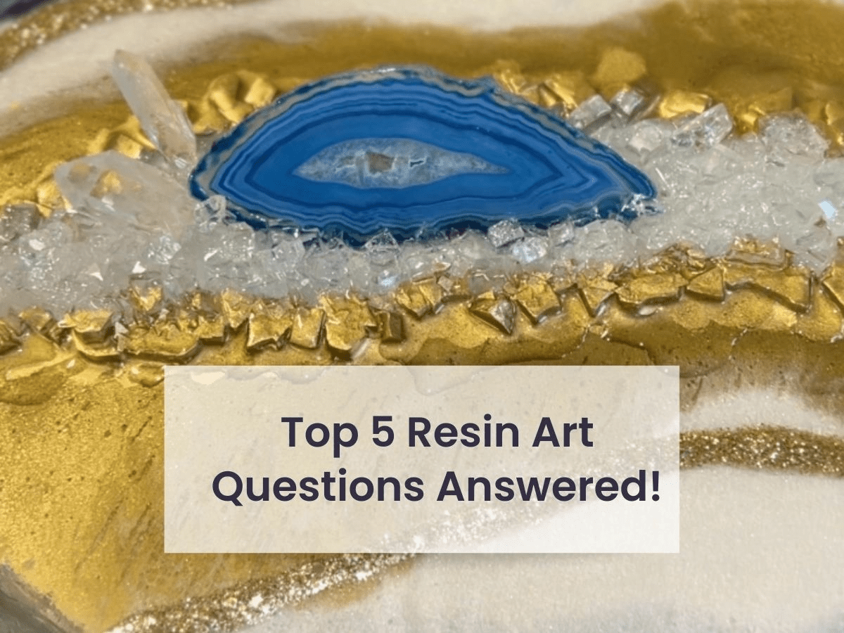 Discover the answers to the ‘Top 5 Resin Art Questions’ with our latest blog post, featuring a stunning close-up image of a resin art piece. This visual guide captures the intricate details of a geode resin art project, highlighting vibrant blue hues encased in glossy epoxy resin, accented by shimmering gold leaf and crystal clear quartz clusters. The captivating texture and depth showcase the beauty of resin art, perfect for DIY enthusiasts and crafters looking to explore this medium. Dive into our blog for expert advice and step-by-step guidance on creating your own resin masterpieces.