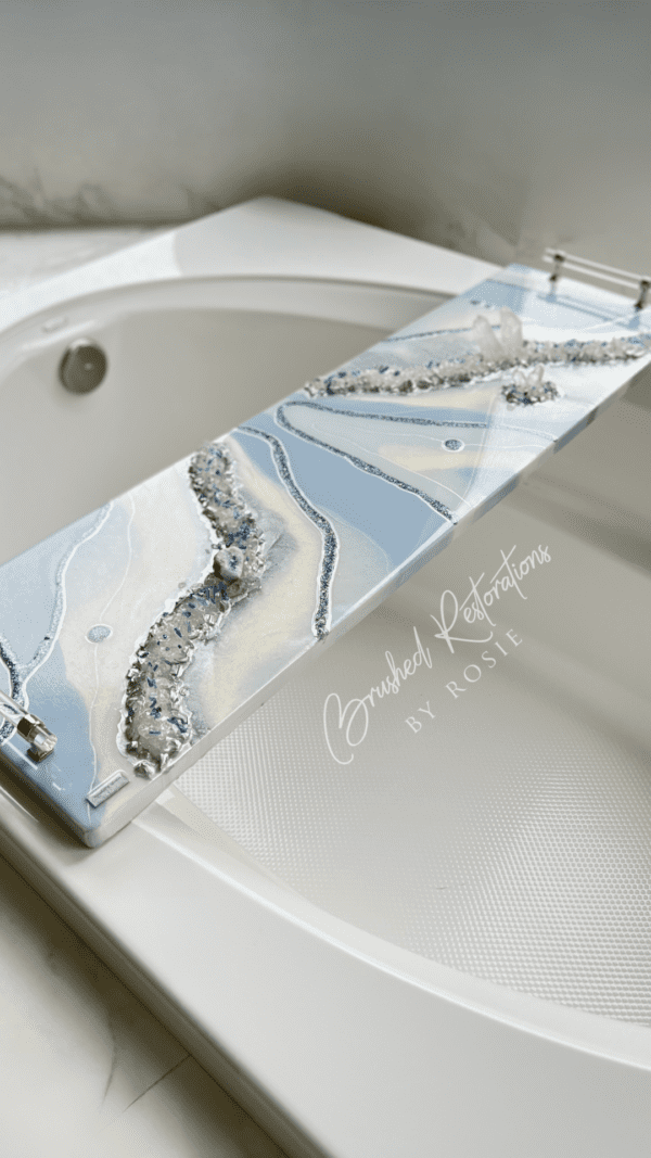 Elegant geode resin bath board by Brushed Restorations placed over a white bathtub, adding luxury to the bathing experience.