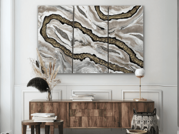 Contemporary high-end home decor with Mosaic Current resin art triptych above a wooden sideboard in a sophisticated interior.