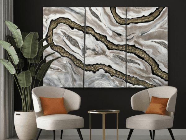 Elegant luxury wall decor featuring Mosaic Current 3D geode resin art triptych in a contemporary living room with stylish chairs.