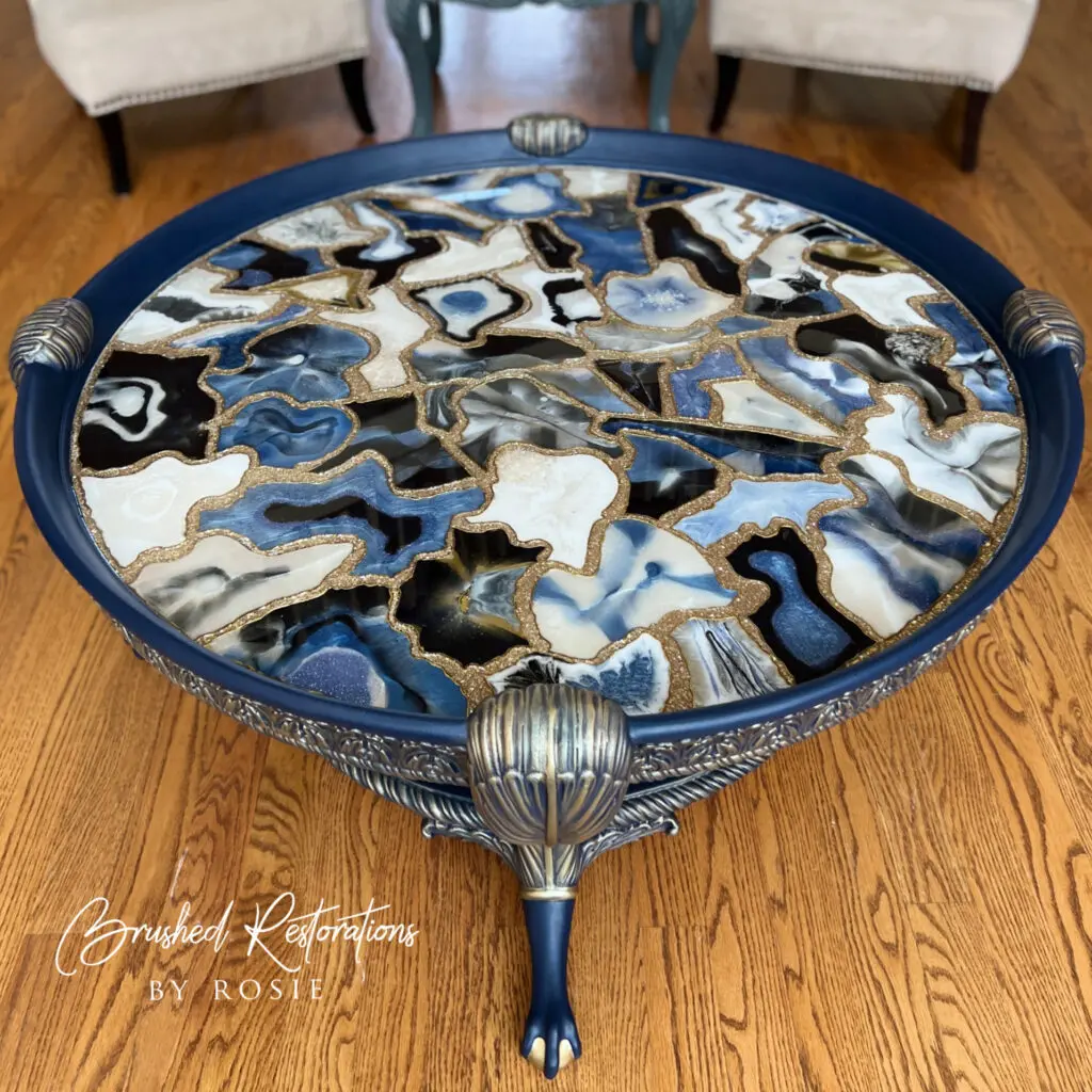 Handcrafted geode-inspired resin table with blue, white, and gold accents made using custom silicone mold